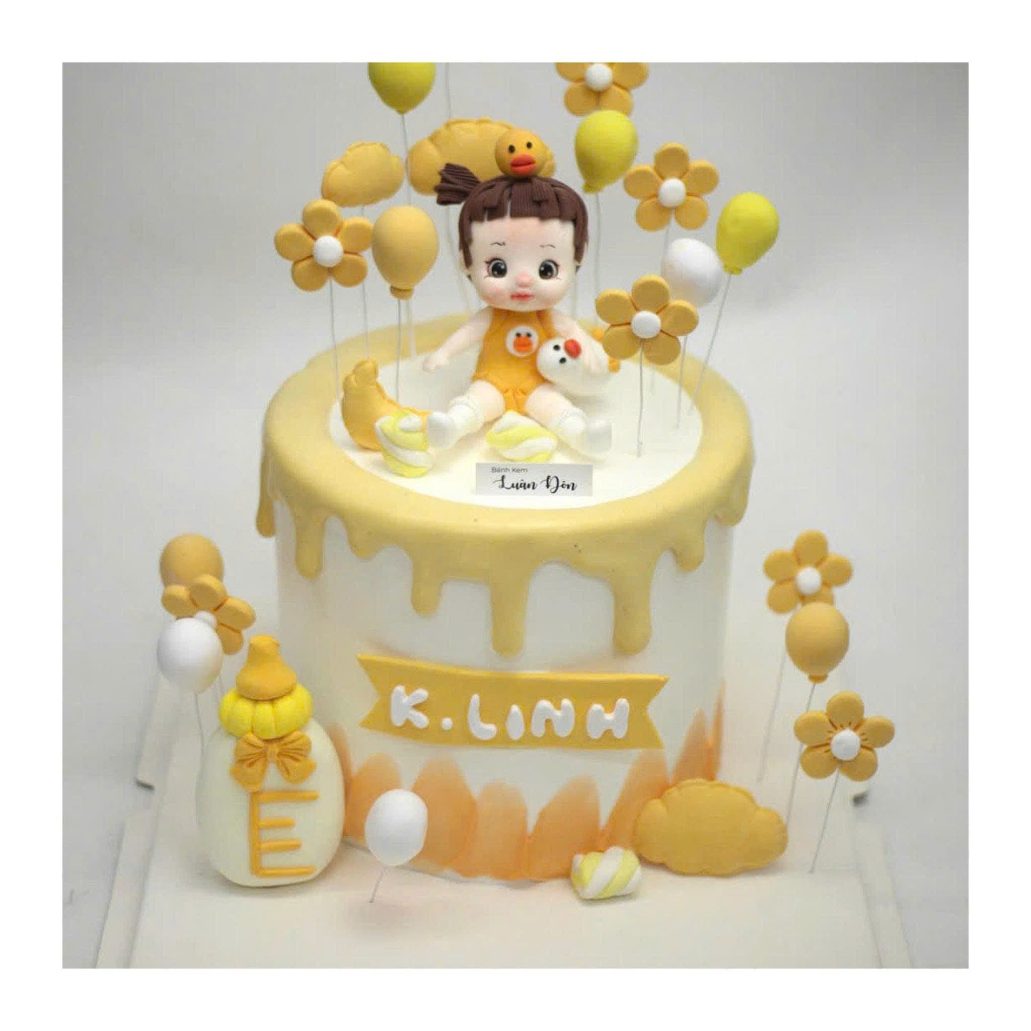Bánh kem thôi nôi bé gái màu vàng - Bánh sinh nhật Tiệm Bánh Luân Đôn