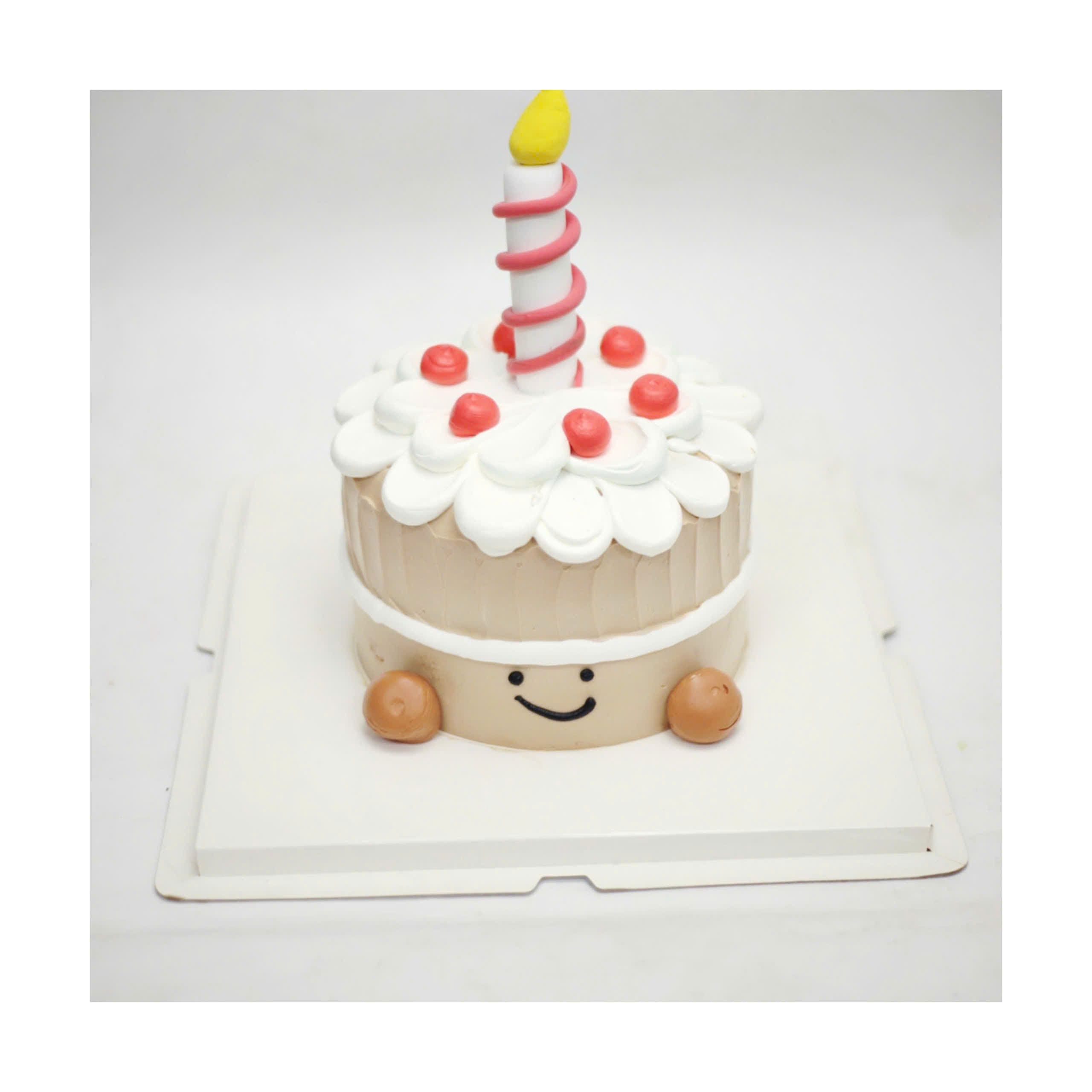 Bánh kem mini trang trí một ngọn nến