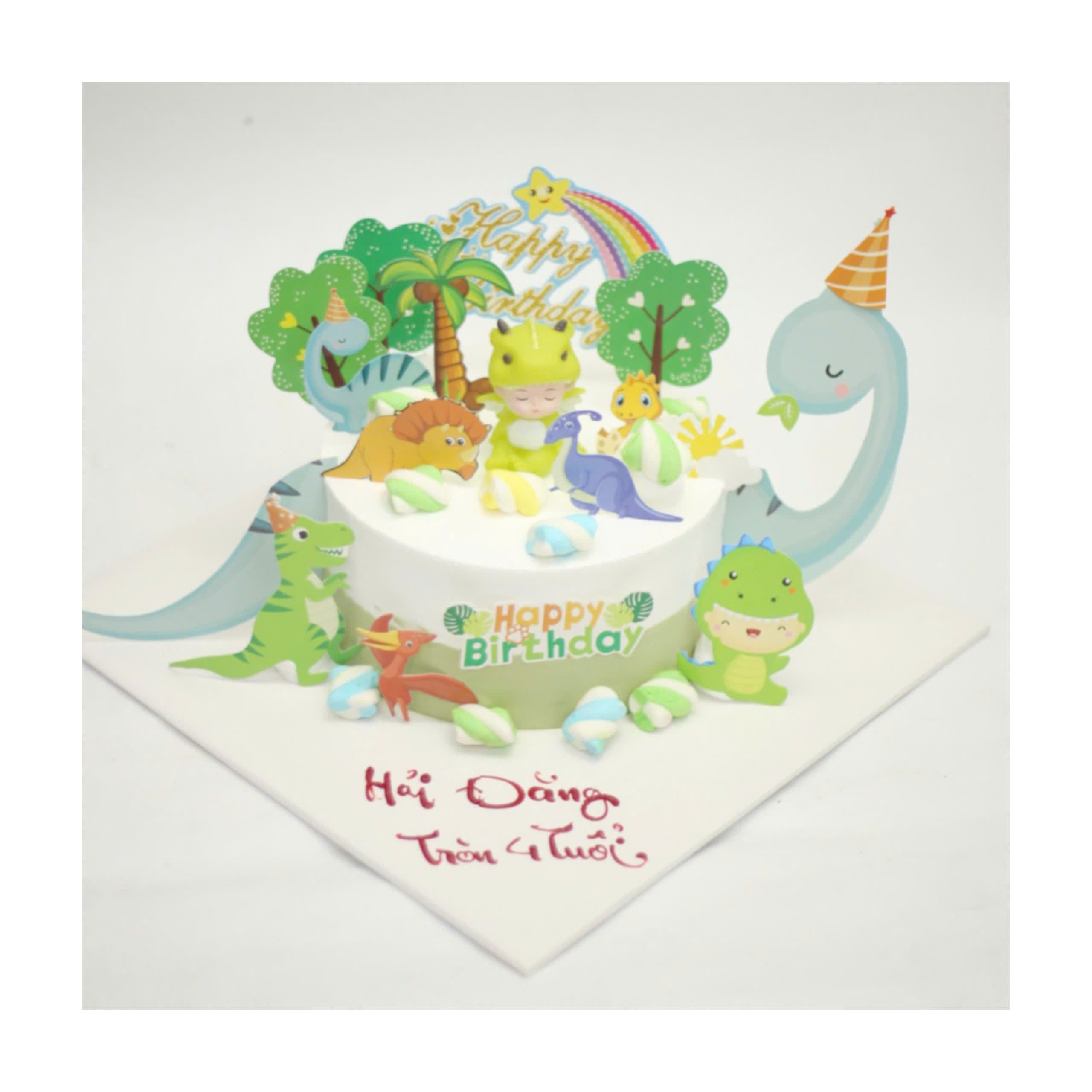 Bánh kem khủng long và bé trai đáng yêu