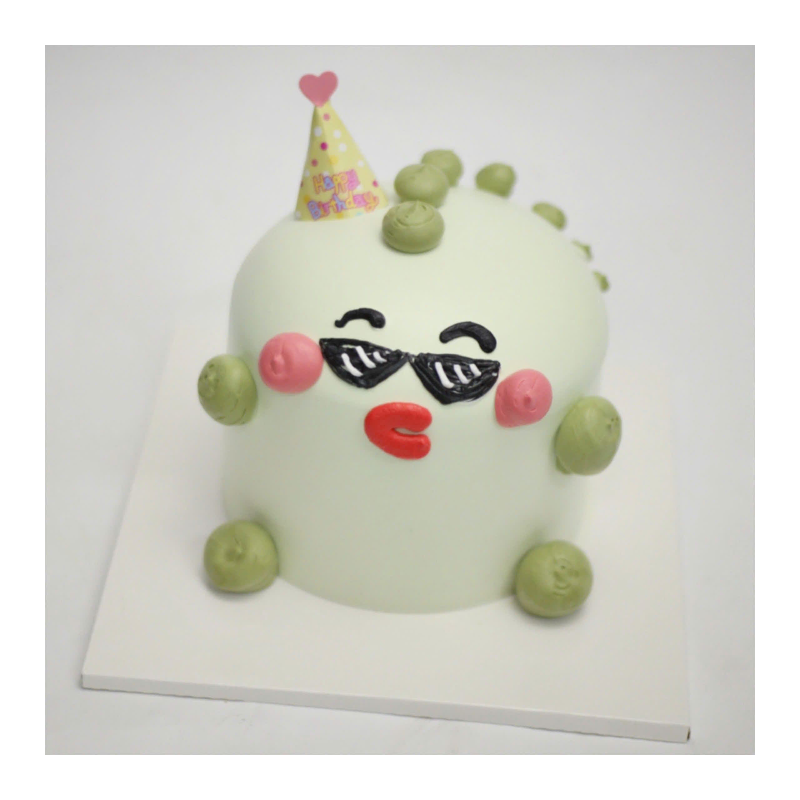 Bánh kem khủng long xanh đeo kính râm