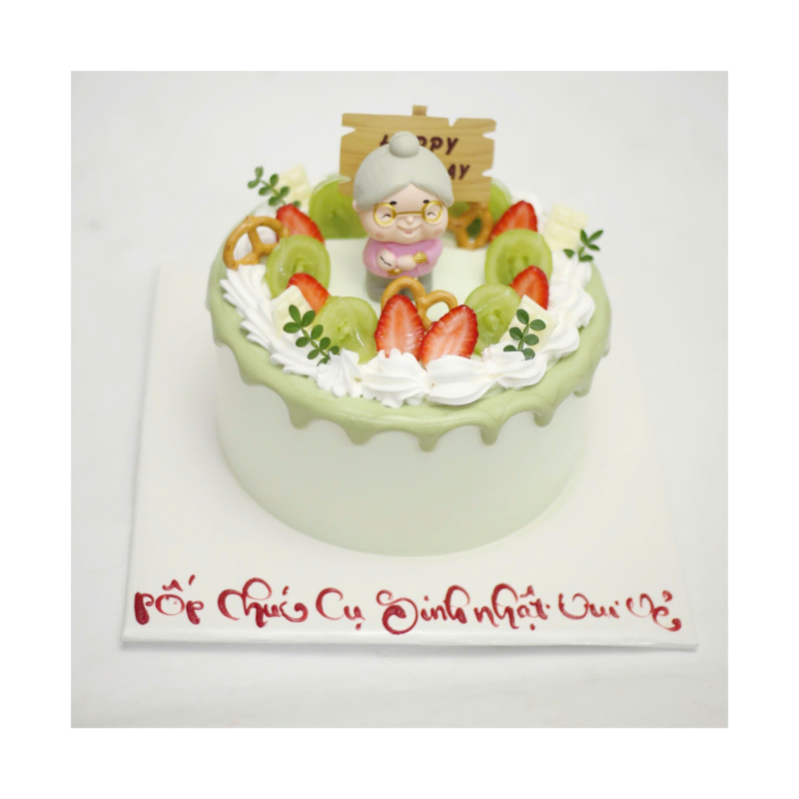 Bánh kem mừng thọ trang trí bà lão và trái cây