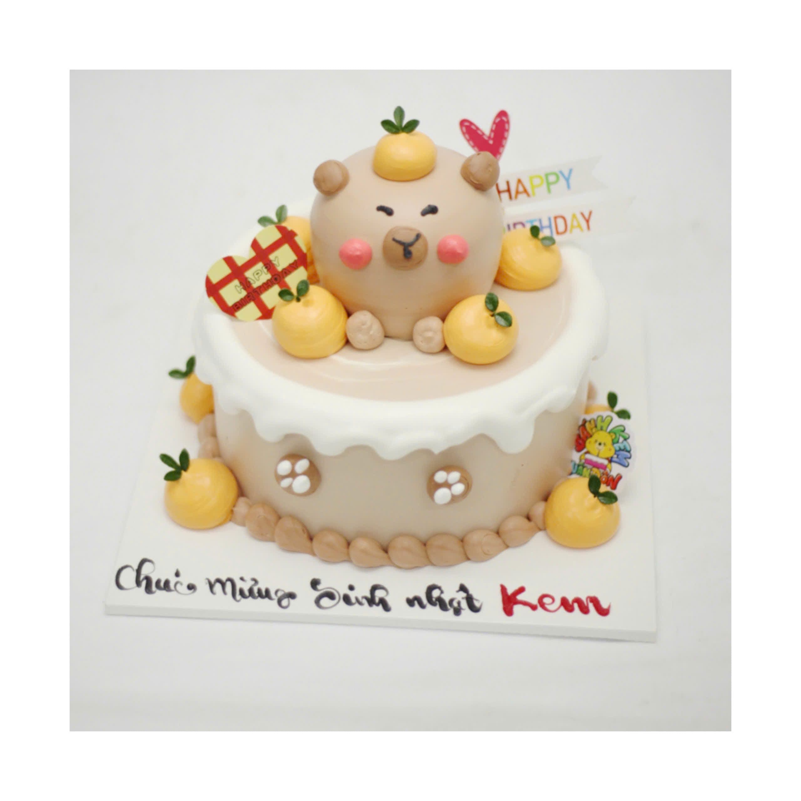 Bánh kem Capybara và quả cam nhỏ