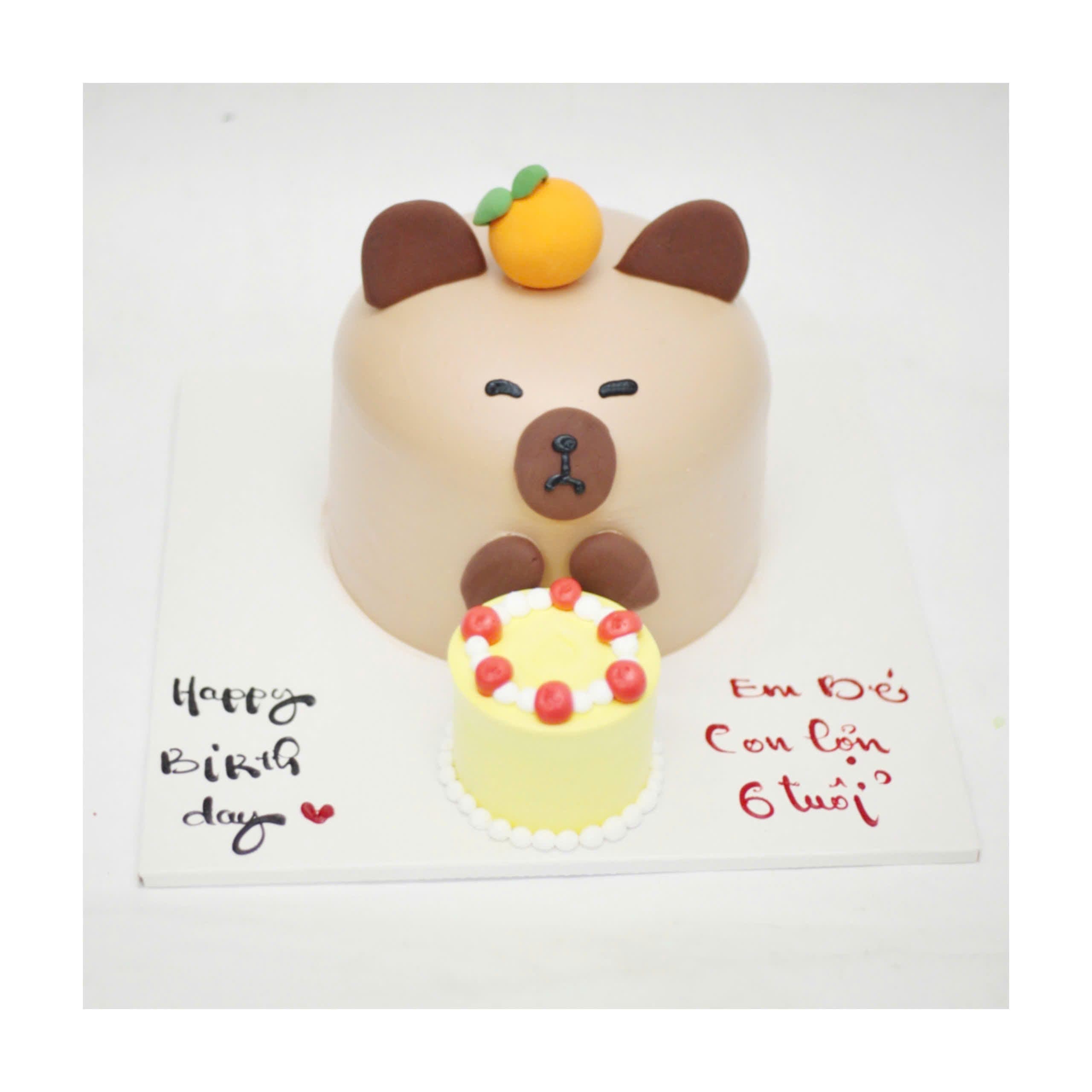 Bánh kem Capybara nâu đeo cam ngộ nghĩnh