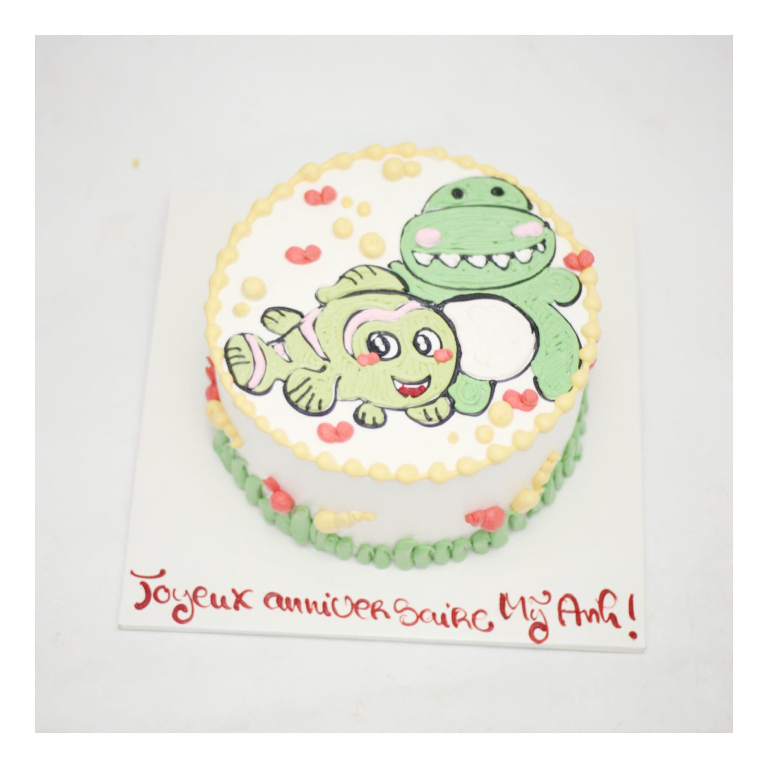 Bánh kem vẽ hình cá và khủng long hoạt hình