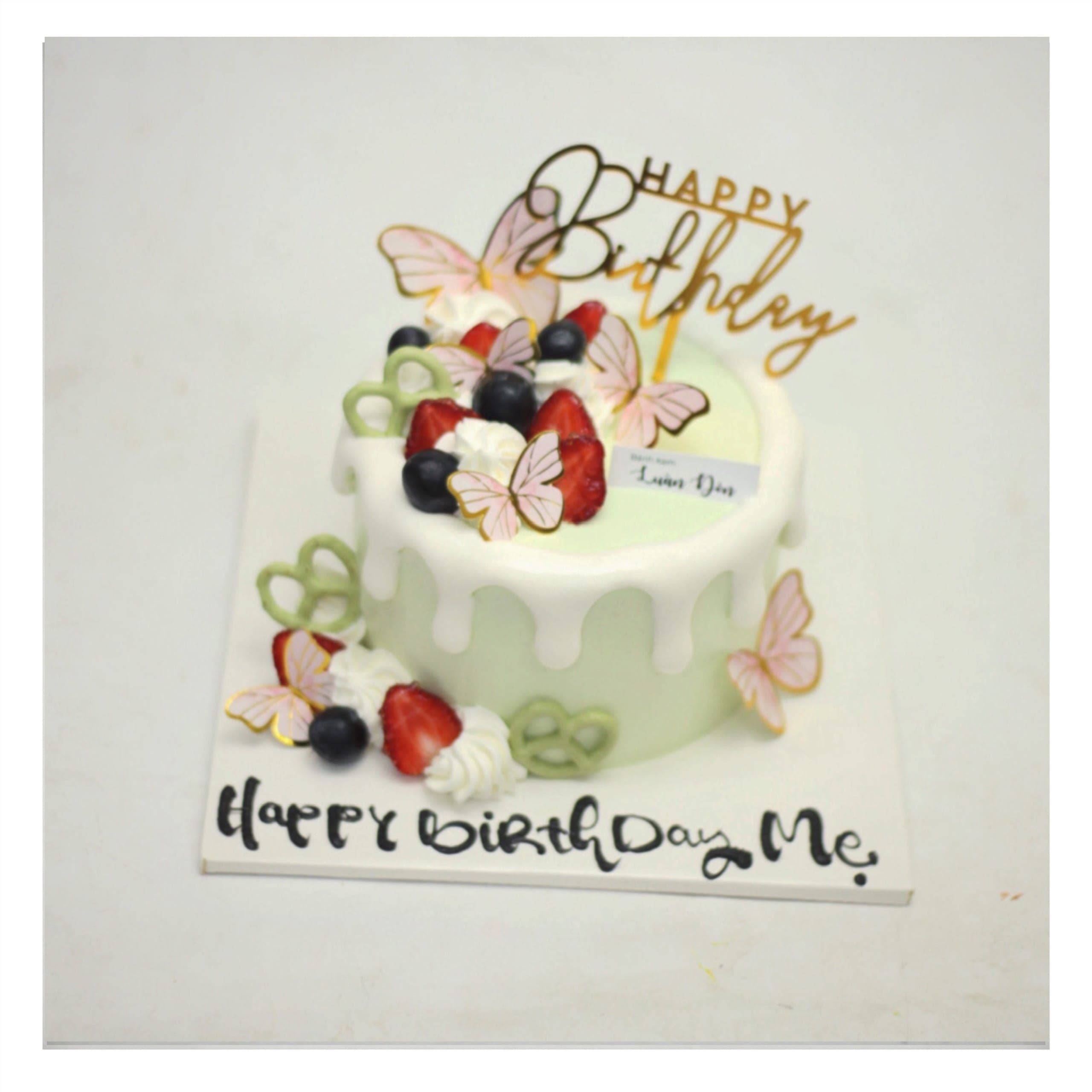 Bánh kem xanh pastel trang trí bướm xinh