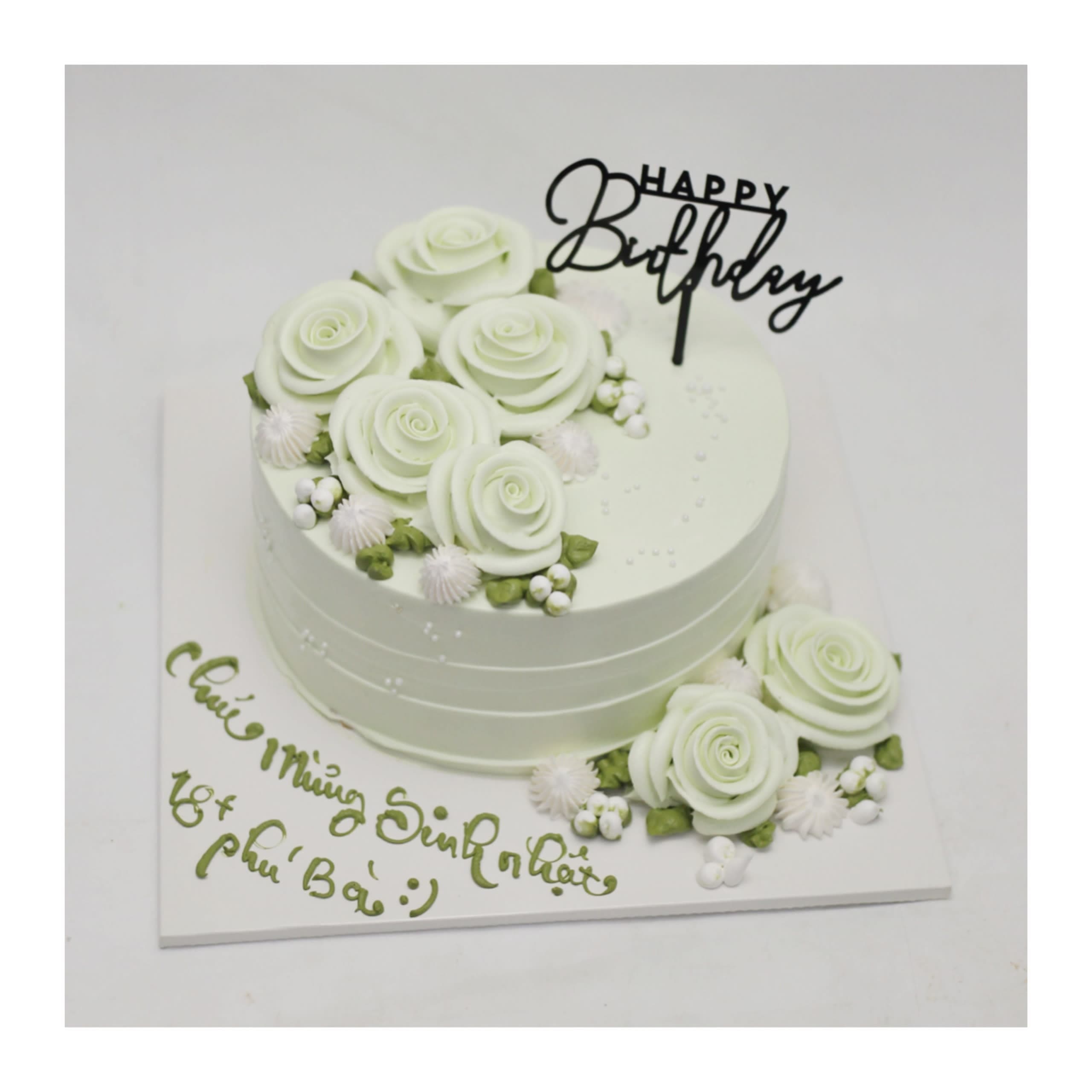 Bánh kem màu xanh nhạt trang trí hoa hồng