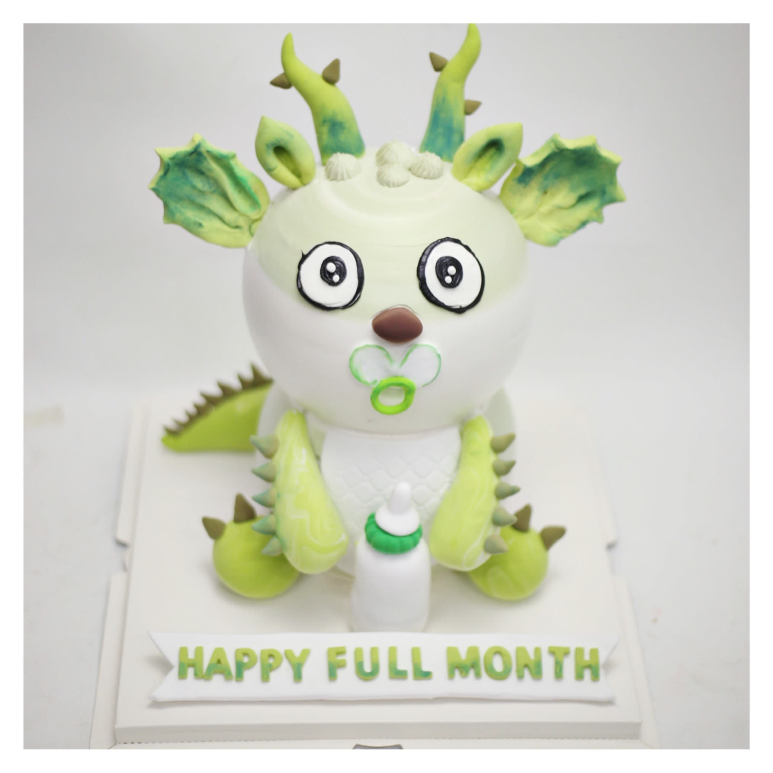 Bánh kem tạo hình rồng xanh đầy tháng bé