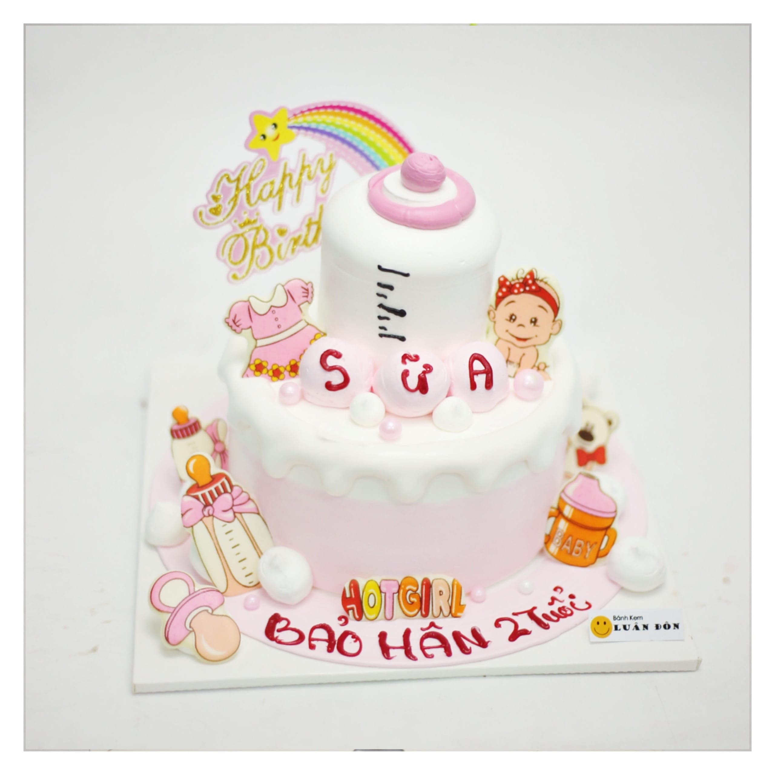 Bánh kem hồng chủ đề bình sữa bé gái